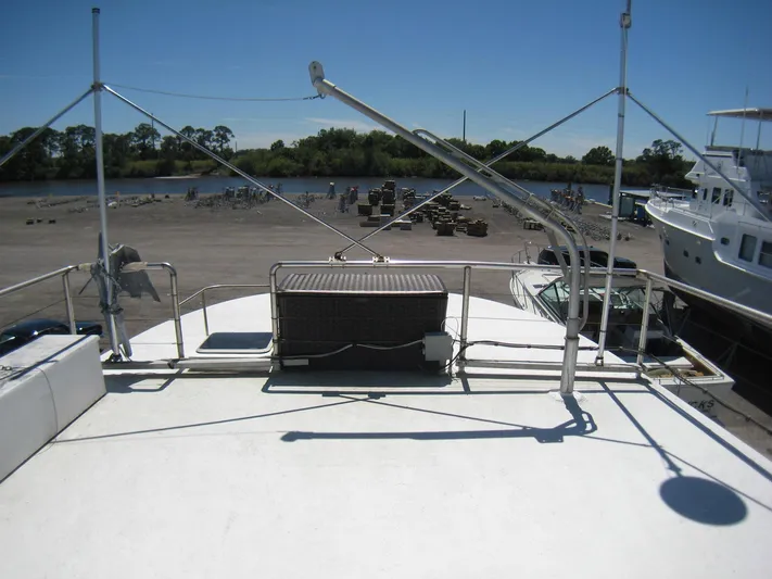 Resolute Yacht Photos Pics 1987 Custom Pilgrim Tribute boat on dry dock, with clear sky and waterfront view.