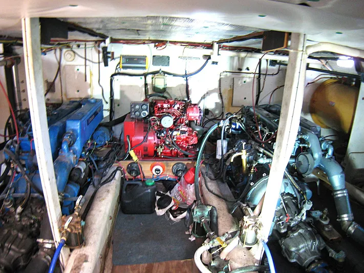 Resolute Yacht Photos Pics Engine room of 1987 Custom Pilgrim Tribute boat with visible machinery and wiring.
