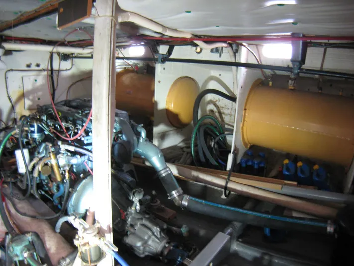 Resolute Yacht Photos Pics Engine room of 1987 Custom Pilgrim Tribute boat with visible machinery and wiring.