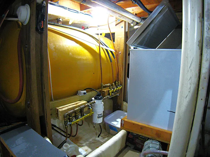Resolute Yacht Photos Pics Engine room of 1987 Custom Pilgrim Tribute with yellow tank and machinery.