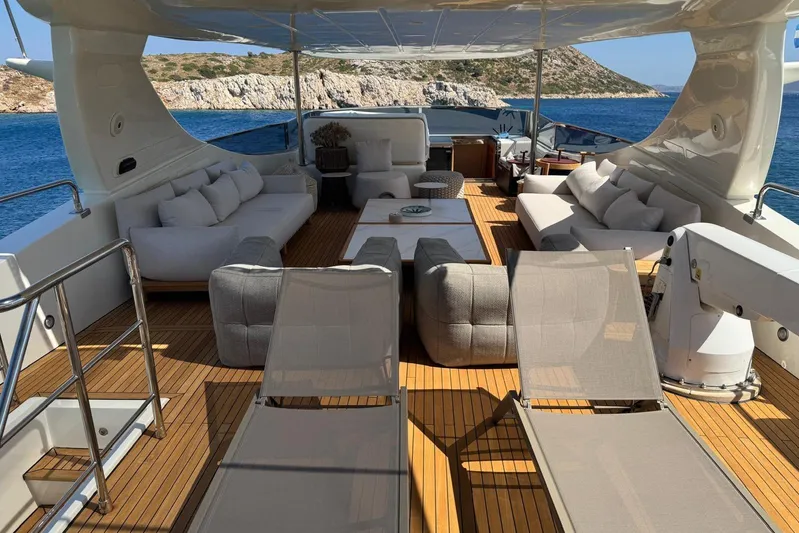  Yacht Photos Pics Luxurious 2011 Falcon 90 yacht deck with elegant seating and scenic ocean view.