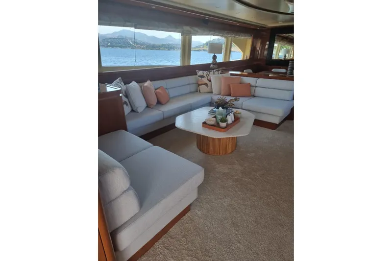  Yacht Photos Pics Luxurious interior of 2011 Falcon 90 yacht with elegant seating and scenic ocean view.
