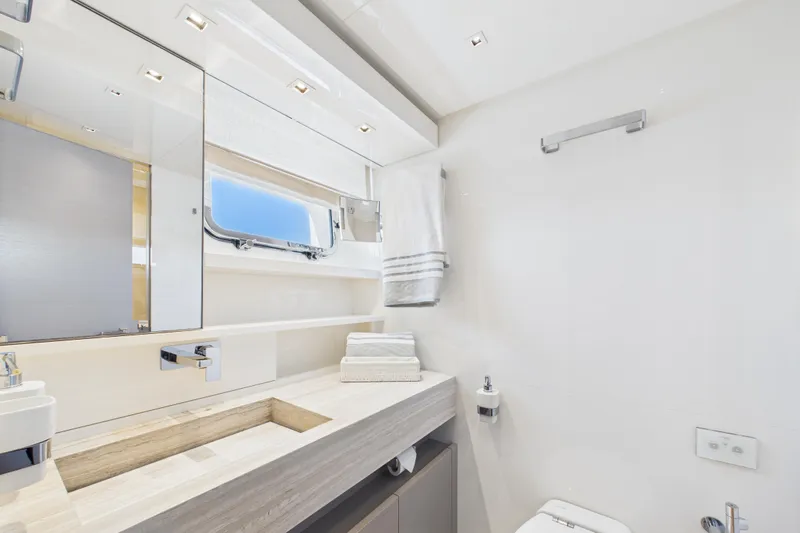  Yacht Photos Pics Luxurious bathroom in 2018 Sanlorenzo SL86 yacht, featuring modern fixtures and elegant design.