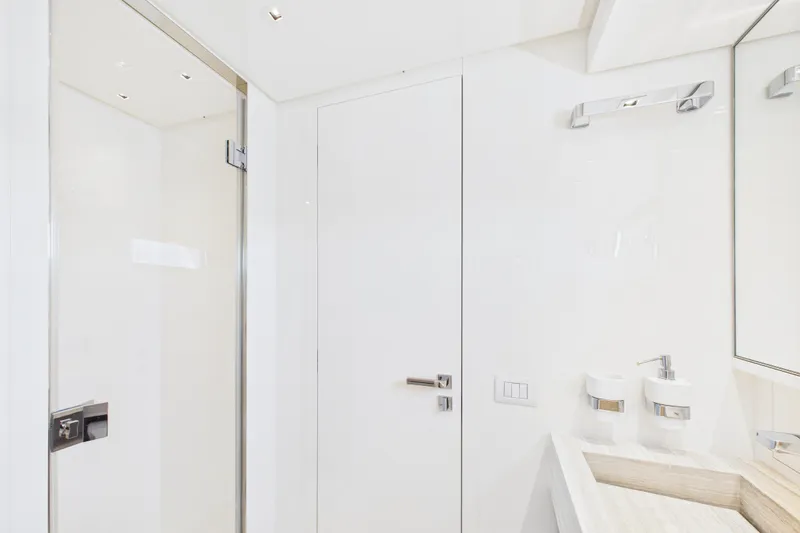  Yacht Photos Pics Luxurious bathroom interior on 2018 Sanlorenzo SL86 yacht, featuring sleek white design and modern fixtures.