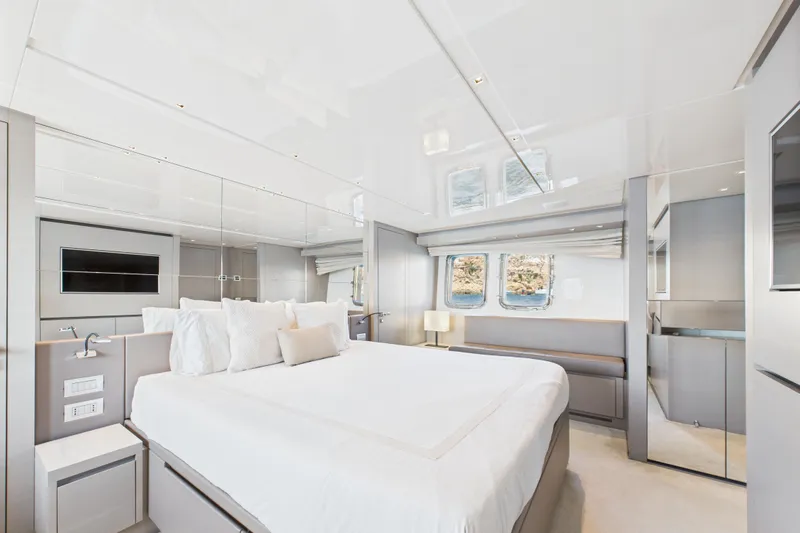  Yacht Photos Pics Luxurious bedroom interior of 2018 Sanlorenzo SL86 yacht with modern design and large windows.