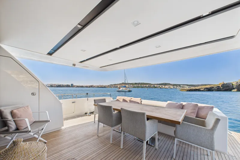  Yacht Photos Pics Luxurious 2018 Sanlorenzo SL86 yacht deck with dining area overlooking serene ocean view.
