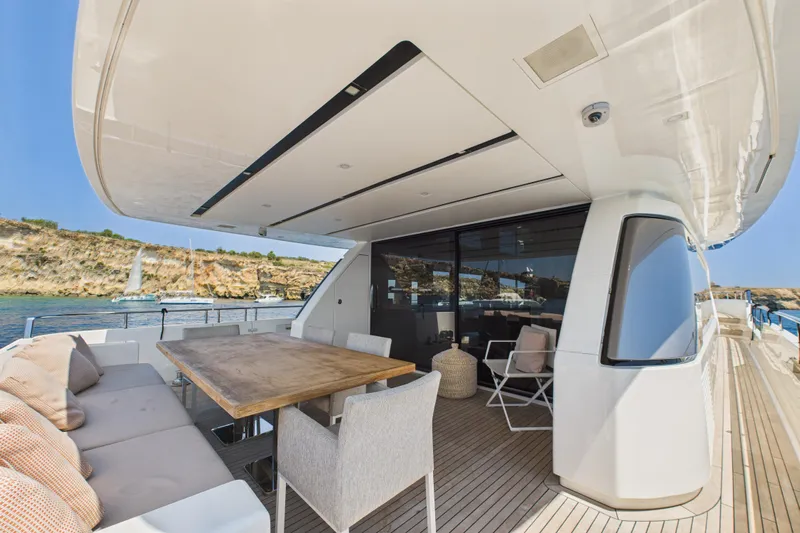  Yacht Photos Pics Luxurious 2018 Sanlorenzo SL86 yacht deck with elegant seating and scenic coastal view.
