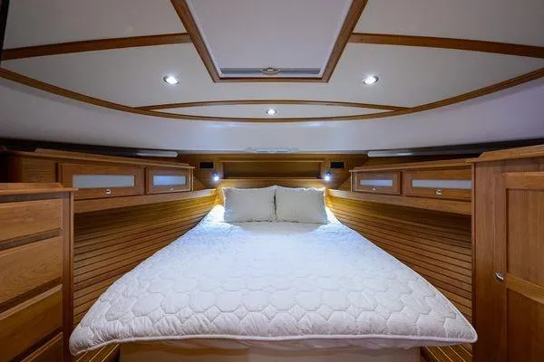  Yacht Photos Pics Luxurious cabin interior of 2022 Sabre 45 Salon Express yacht with cozy bedding.