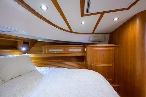  Yacht Photos Pics Luxurious cabin interior of 2022 Sabre 45 Salon Express yacht with wood finish.