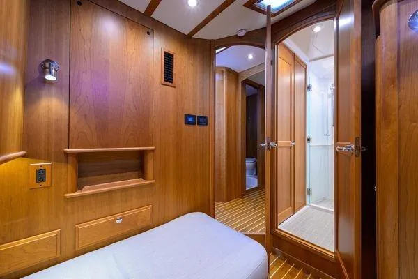  Yacht Photos Pics 2022 Sabre 45 Salon Express interior with wooden finish and modern bathroom.