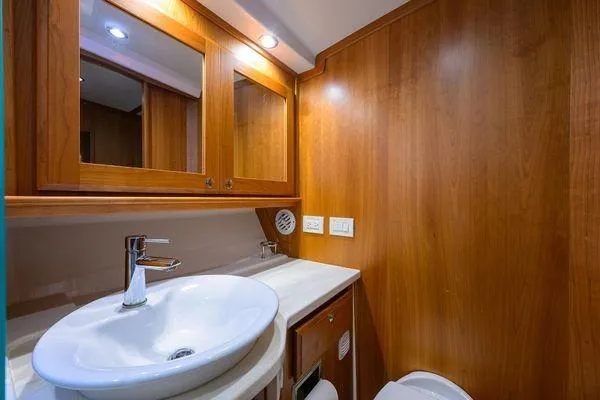 Yacht Photos Pics Luxurious bathroom in 2022 Sabre 45 Salon Express yacht with wooden cabinetry.