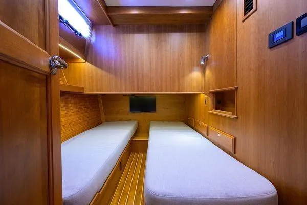  Yacht Photos Pics 2022 Sabre 45 Salon Express cabin with twin beds and wooden interior.