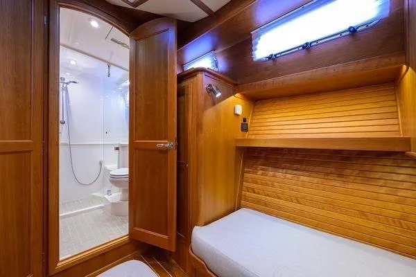  Yacht Photos Pics 2022 Sabre 45 Salon Express interior with wooden cabin and modern bathroom.