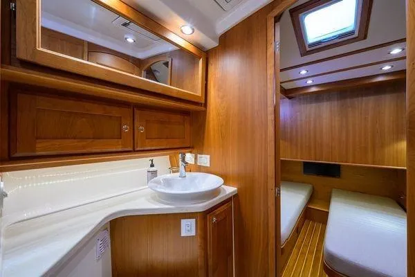 Yacht Photos Pics Luxurious 2022 Sabre 45 Salon Express interior with wood finish and modern amenities.