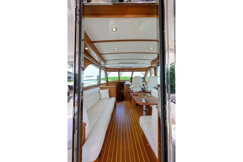  Yacht Photos Pics Luxurious interior of 2022 Sabre 45 Salon Express yacht with elegant wood finishes.