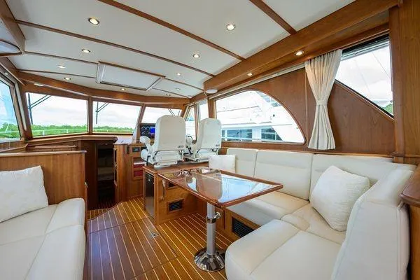  Yacht Photos Pics Luxurious interior of 2022 Sabre 45 Salon Express yacht with elegant wood finishes.