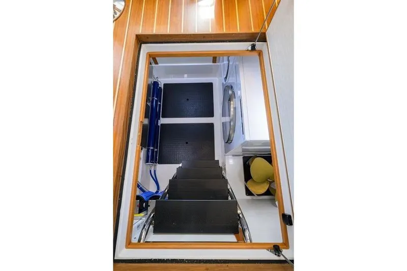  Yacht Photos Pics Engine room access of 2022 Sabre 45 Salon Express yacht, featuring sleek interior design.