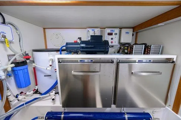  Yacht Photos Pics Engine room of 2022 Sabre 45 Salon Express with stainless steel components and control panels.