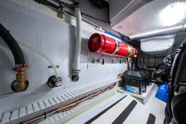  Yacht Photos Pics Engine room of 2022 Sabre 45 Salon Express with fire extinguisher and wiring.