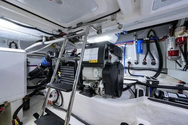  Yacht Photos Pics Engine room of 2022 Sabre 45 Salon Express yacht with ladder and equipment.