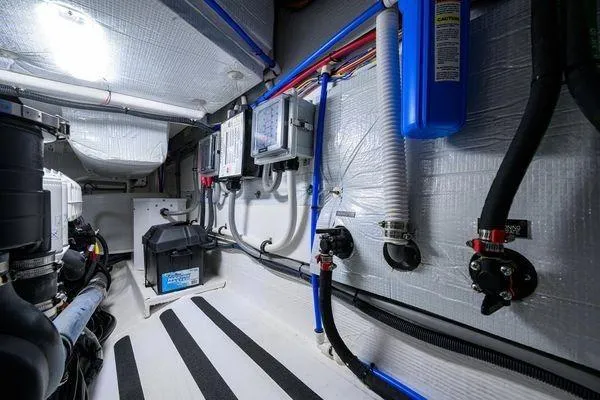 Yacht Photos Pics Engine room of 2022 Sabre 45 Salon Express yacht, showcasing wiring and equipment.