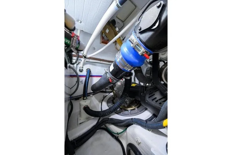  Yacht Photos Pics Engine room of 2022 Sabre 45 Salon Express with visible hoses and components.