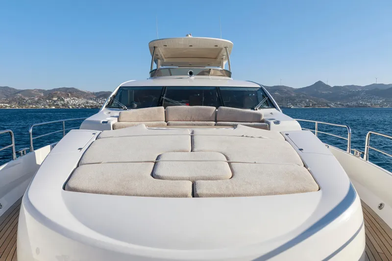 Merci Yacht Photos Pics Sunseeker 88 Yacht 2010 on open water, featuring spacious sunbathing deck.