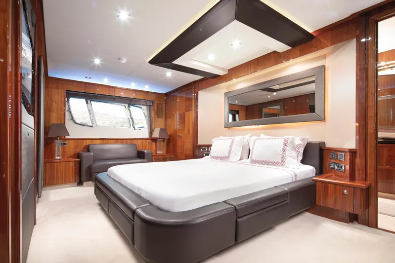 Merci Yacht Photos Pics Luxurious bedroom interior of 2010 Sunseeker 88 Yacht with modern furnishings and elegant design.