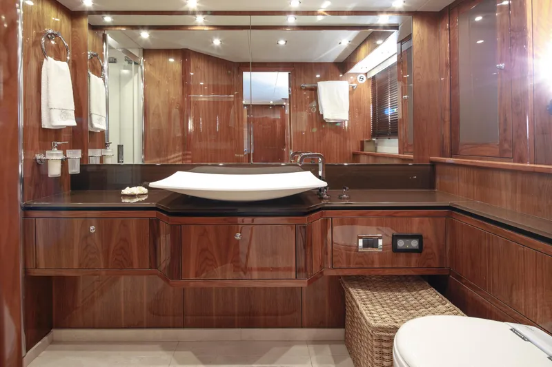 Merci Yacht Photos Pics Luxurious bathroom interior of 2010 Sunseeker 88 Yacht with elegant wood finish.