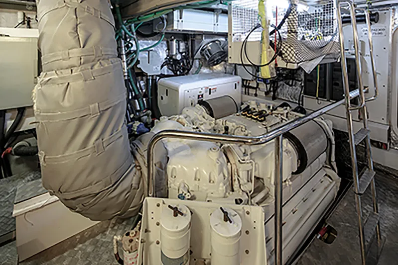Merci Yacht Photos Pics Engine room of a 2010 Sunseeker 88 Yacht, featuring machinery and equipment.