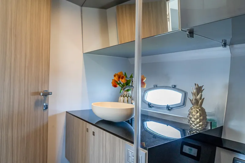  Yacht Photos Pics Luxurious bathroom interior of 2024 Rio Yachts Daytona 35 with modern fixtures and decor.