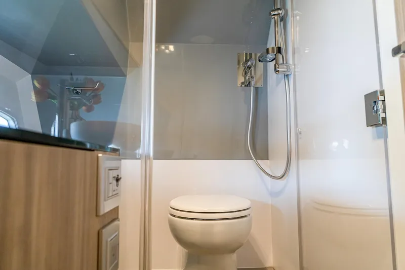  Yacht Photos Pics Modern bathroom in 2024 Rio Yachts Daytona 35, featuring shower and toilet.