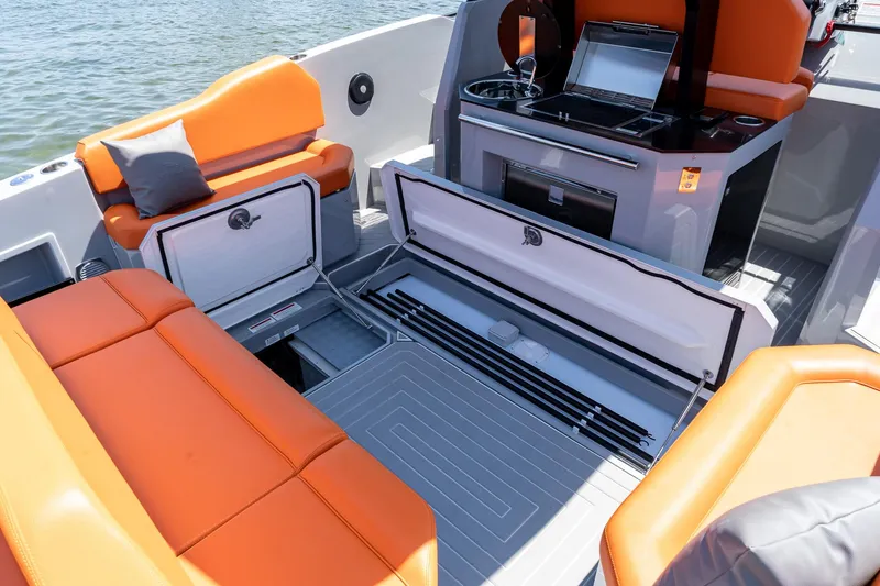  Yacht Photos Pics 2024 Rio Yachts Daytona 35 interior with orange seating and storage compartments.
