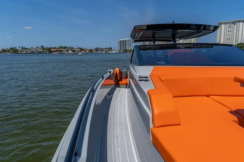  Yacht Photos Pics 2024 Rio Yachts Daytona 35 with vibrant orange seating, cruising on a sunny day.