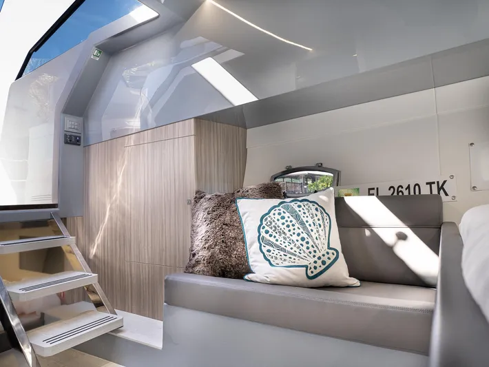  Yacht Photos Pics 2024 Rio Yachts Daytona 35 interior with modern seating and decorative pillows.