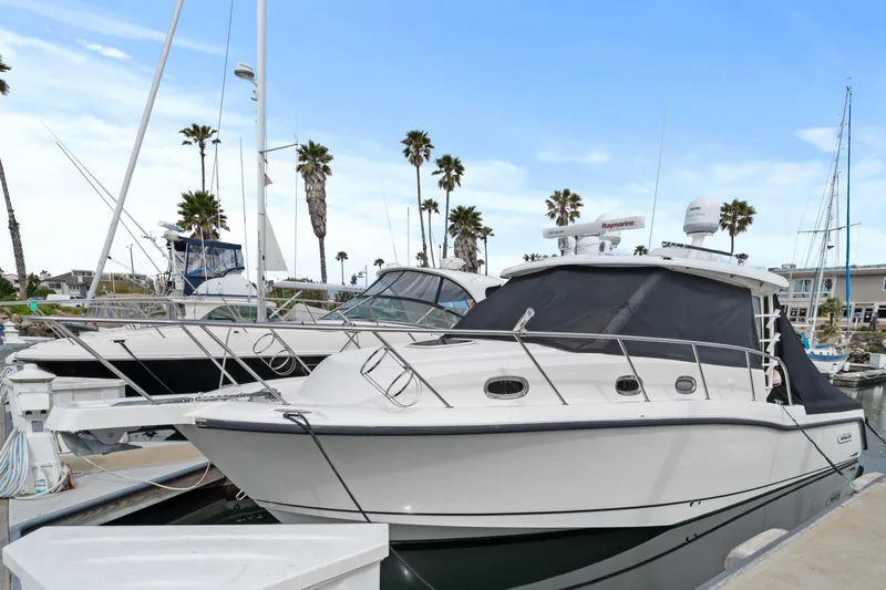  Yacht Photos Pics 2017 Boston Whaler 345 Conquest Pilothouse docked at a marina.