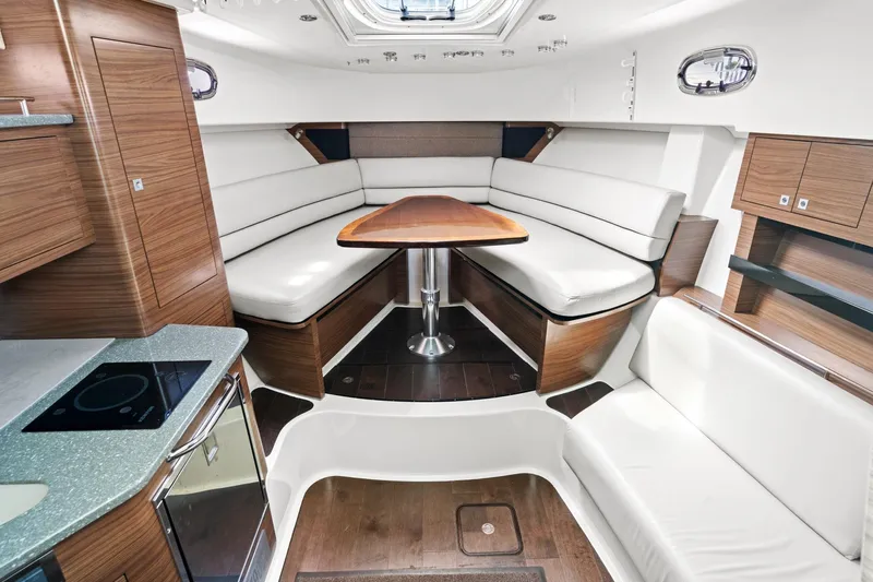  Yacht Photos Pics 2017 Boston Whaler 345 Conquest Pilothouse interior with modern seating and dining area.