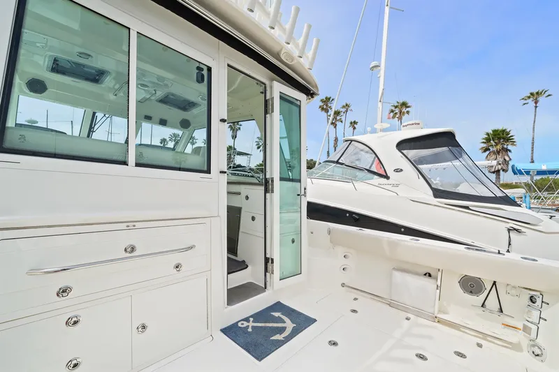  Yacht Photos Pics 2017 Boston Whaler 345 Conquest Pilothouse, docked, showing cockpit and pilothouse entrance.