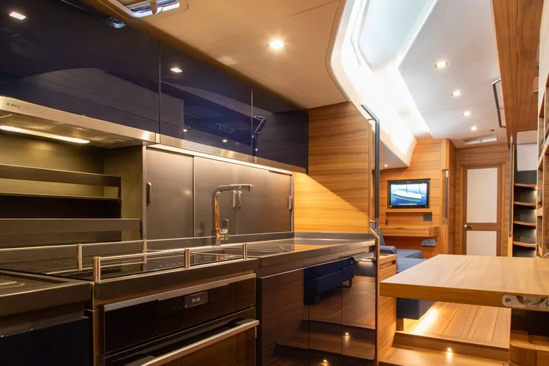  Yacht Photos Pics Luxurious interior of 2026 Ice Yachts 70, featuring modern kitchen and sleek design elements.
