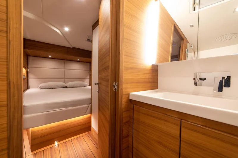  Yacht Photos Pics Luxurious interior of 2026 Ice Yachts 70, featuring a cozy bedroom and modern bathroom.