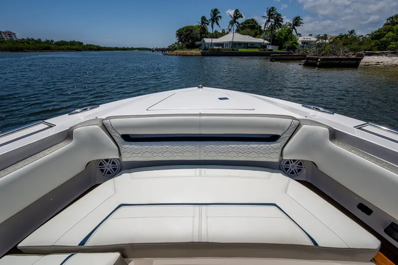 Let It Ride Yacht Photos Pics 2024 Tiara Yachts 38 LS boat interior with luxurious seating on a serene waterway.