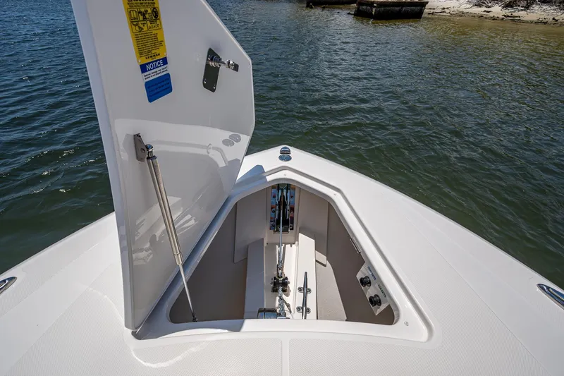 Let It Ride Yacht Photos Pics 2024 Tiara Yachts 38 LS anchor compartment open on calm water.