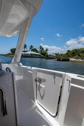 Let It Ride Yacht Photos Pics 2024 Tiara Yachts 38 LS, docked with scenic waterfront view under clear blue sky.