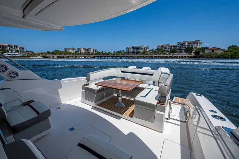Let It Ride Yacht Photos Pics 2024 Tiara Yachts 38 LS luxury yacht with elegant seating and scenic waterfront view.