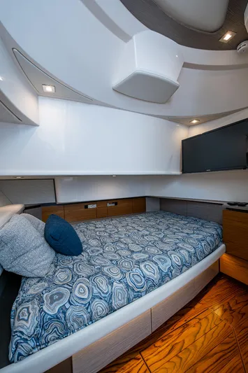 Let It Ride Yacht Photos Pics 2024 Tiara Yachts 38 LS cabin interior with modern design and cozy bedding.