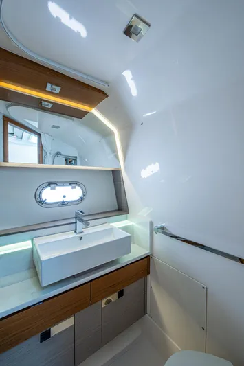 Let It Ride Yacht Photos Pics 2024 Tiara Yachts 38 LS bathroom with modern sink and mirror design.