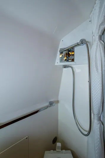 Let It Ride Yacht Photos Pics 2024 Tiara Yachts 38 LS bathroom with modern shower fixtures and white interior.