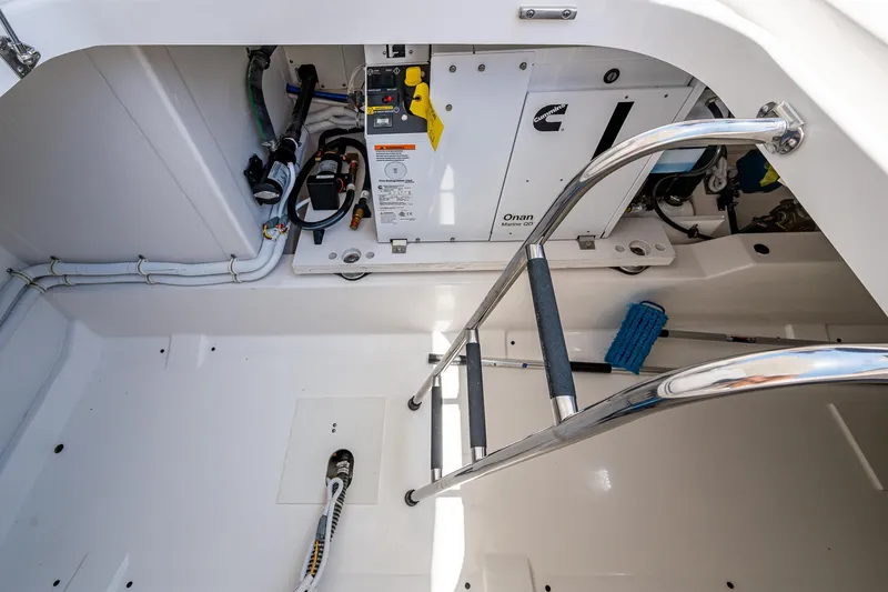 Let It Ride Yacht Photos Pics Engine compartment of 2024 Tiara Yachts 38 LS with ladder and equipment.