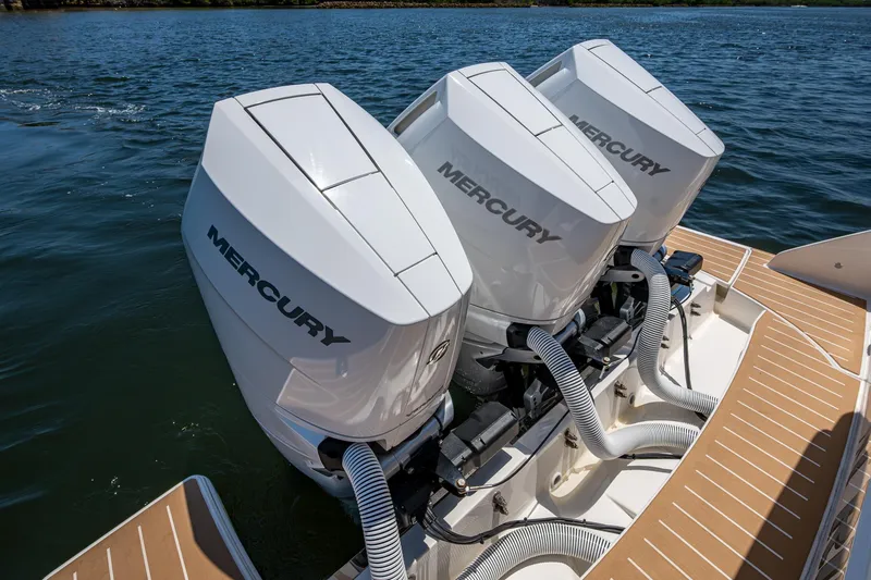 Let It Ride Yacht Photos Pics 2024 Tiara Yachts 38 LS with triple Mercury outboard engines on water.