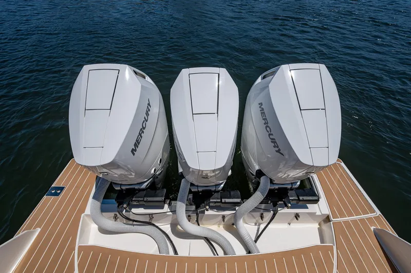 Let It Ride Yacht Photos Pics 2024 Tiara Yachts 38 LS with triple Mercury outboard engines on water.